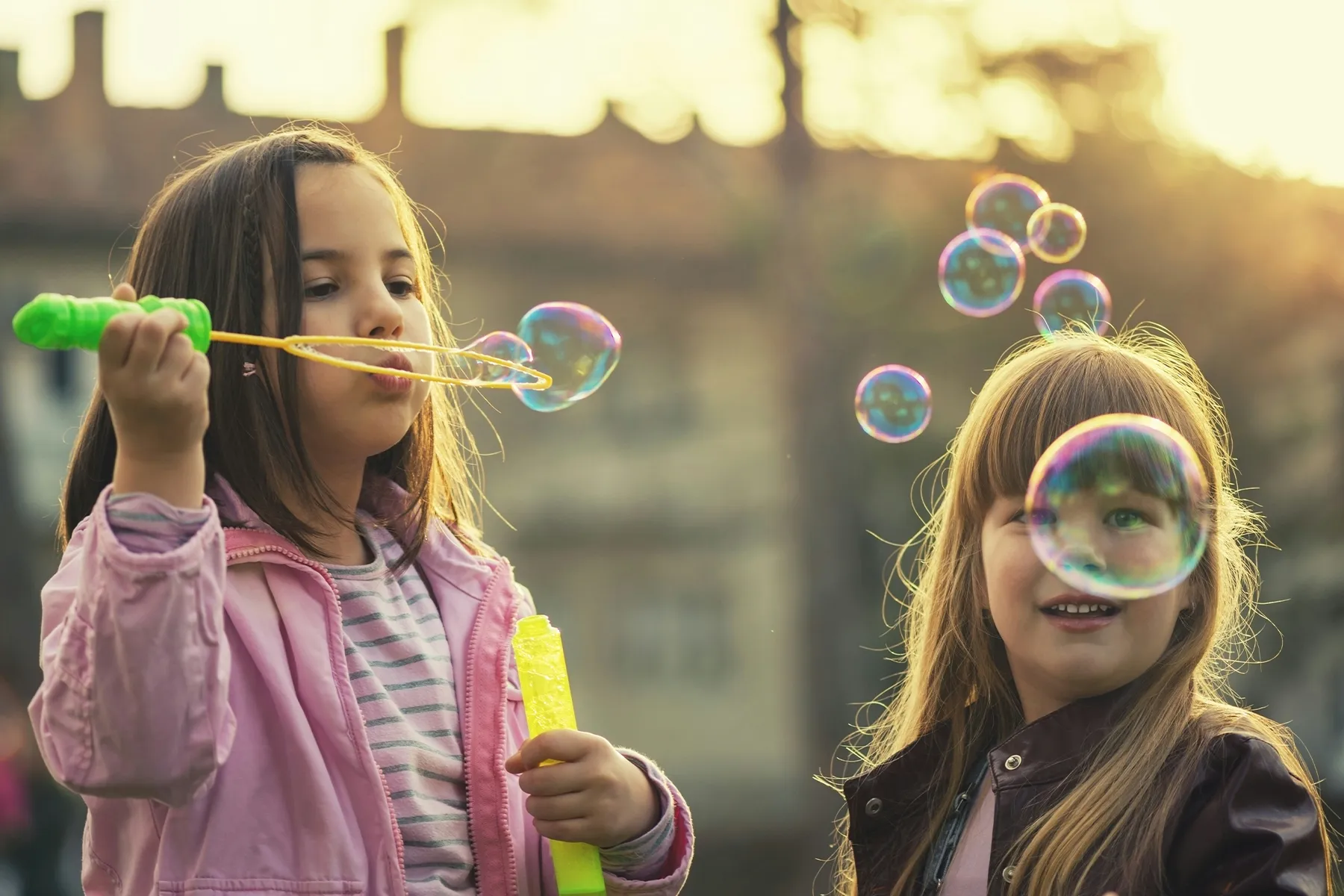Children blowing bubbles